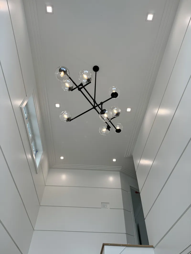 Modern sputnik chandelier in a stairwell — MTL Electric, Long Island