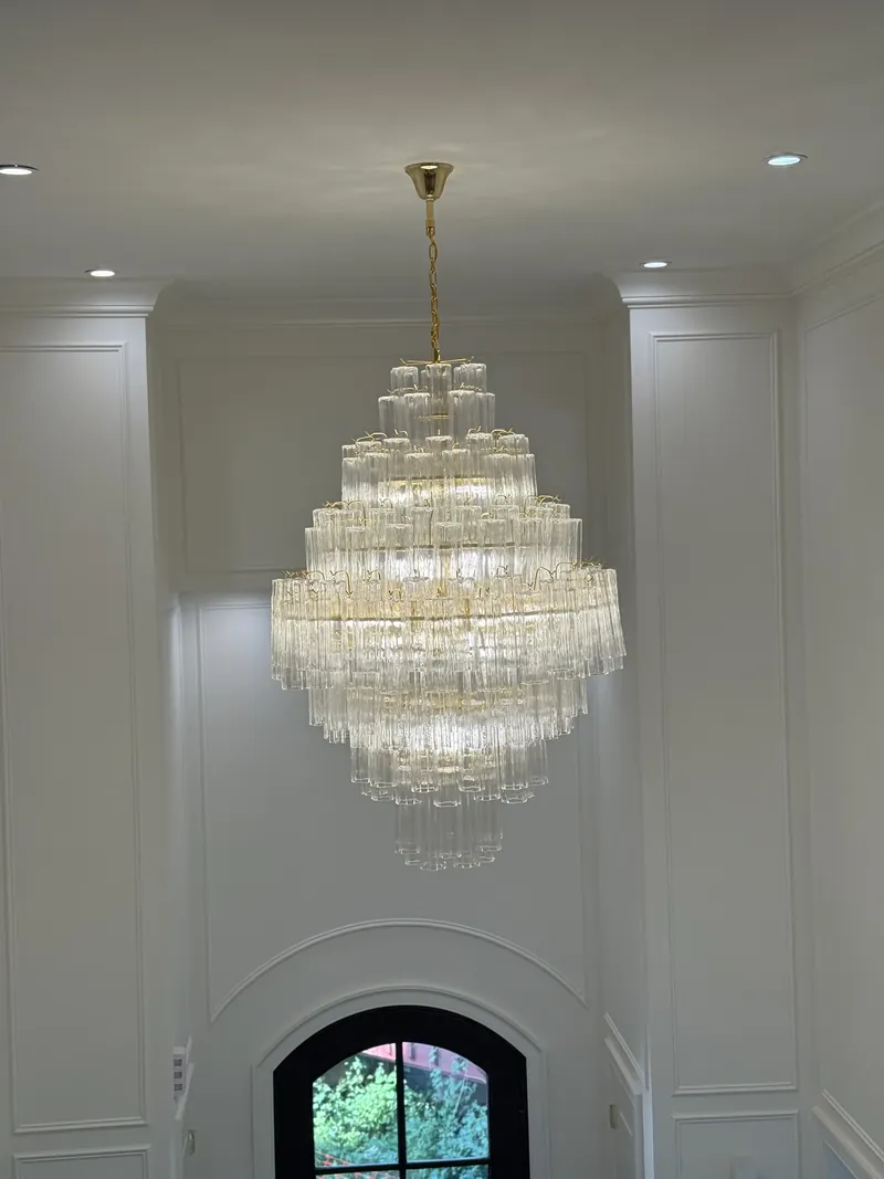 Tiered chandelier over a stairwell — MTL Electric, Long Island